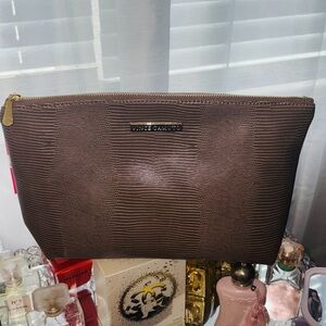 She likes certain Textured Brown pouch 👝 🤎